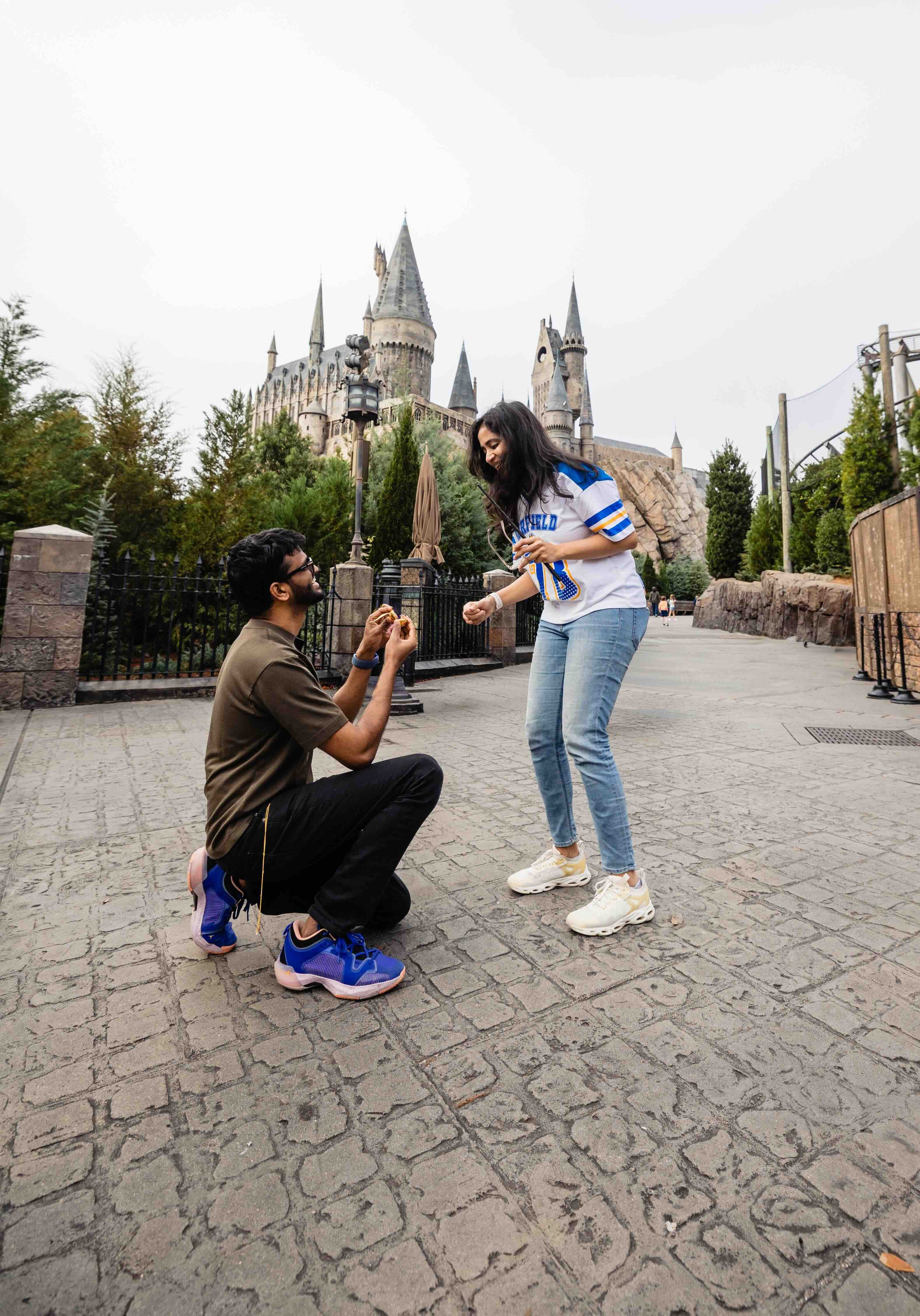 Gautham proposing to Bhavna in front of Hogwarts castle